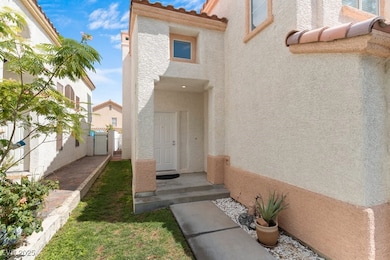 Property entrance featuring stucco siding and a tile roof