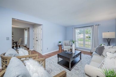 Living area featuring wood finished floors and baseboards
