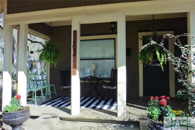 Inviting front porch ready to entertain. Come set 