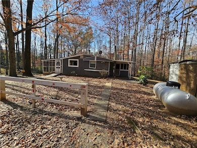 View of front of property featuring a sunroom