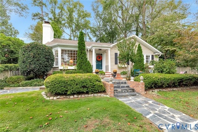 View of front of house featuring a chimney