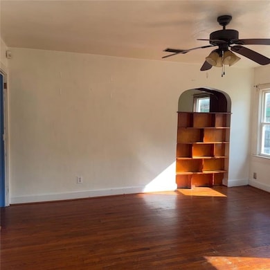 Family room with dark wood-type flooring and ceili