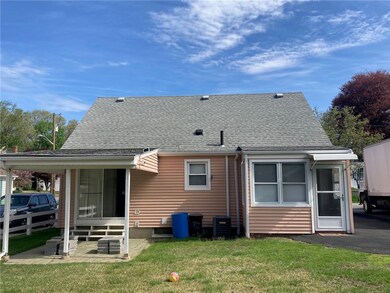 rear view of home with covered patio and enclosed