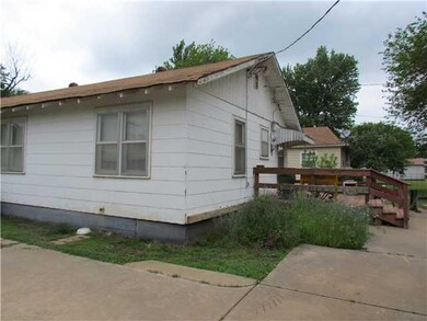 Exterior Back. Back of home and view of deck