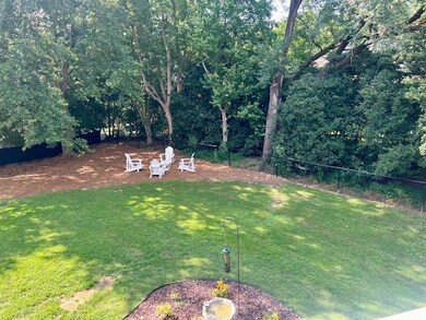 View of backyard and fire pit area