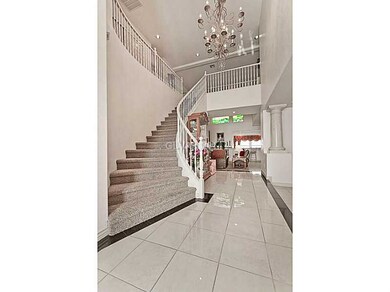 Property Photo. Grand entry staircase.