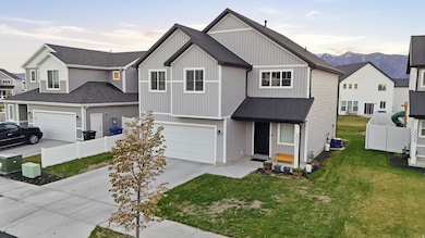View of front of property featuring concrete driveway, a shingled roof, a residential view, board and batten siding, and a garage
