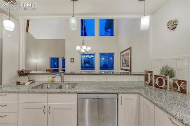 Kitchen overlooking dining room and living room