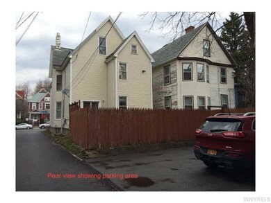Exterior Back. 2 space parking pad