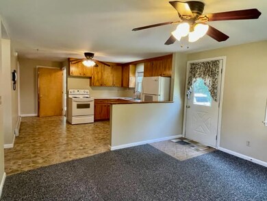Dining area looking to kitchen