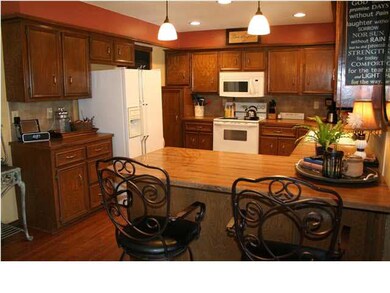 Kitchen features deep cabinets, an eating bar, and