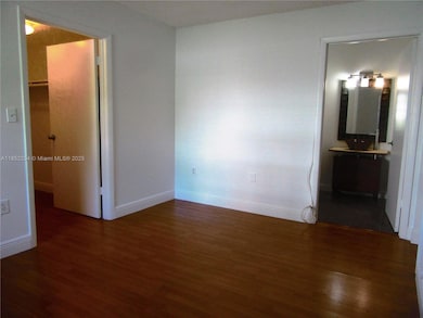 Main bedroom shows walk-in closet and bathroom access.