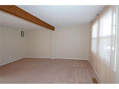 Living Room. Spacious and sunny living room featur