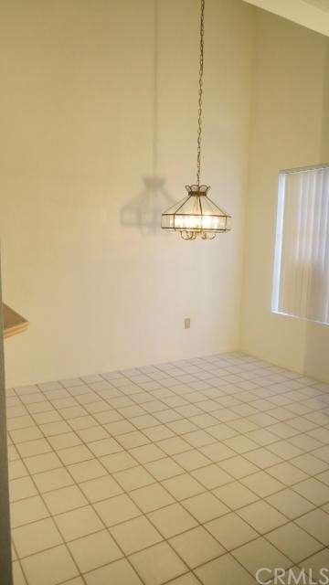 Dining room with vaulted ceiling.