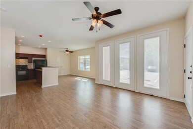 Unfurnished living room with baseboards, ceiling f