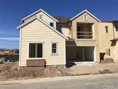 Lovely exterior with front balcony and two car gar