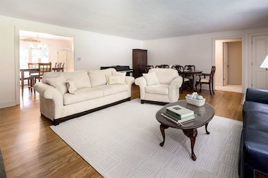 Gorgeous wood floors open concept to Dining Area