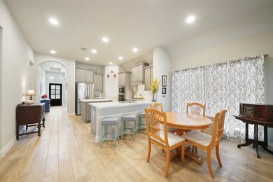 The kitchen dining area is between the breakfast b