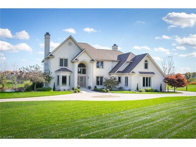 Fabulous front view of home with circular driveway