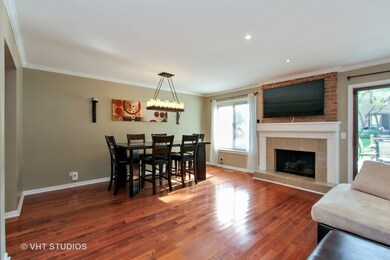 Dining Room with mounted TV above fireplace
