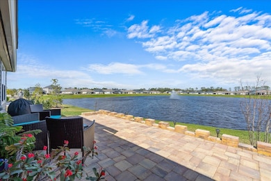 View of patio / terrace with a water view and a residential view
