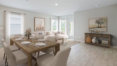 Dining area with baseboards, light wood-style floo