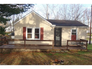 Back of home with deck