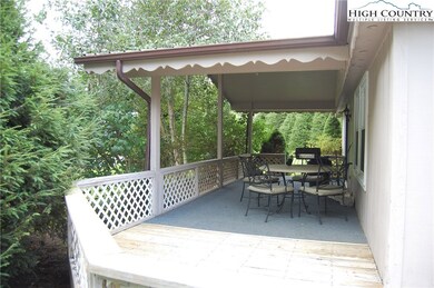 Walk around covered porch from front entrance.
