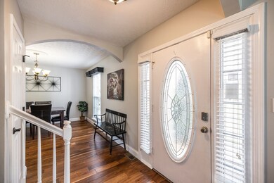 Dining room and living room are visible from the front entrance.