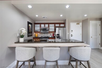 Kitchen with extended breakfast bar.