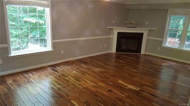 Living/Family room with 3 walls of windows flowing