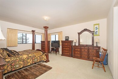 This is the second master bedroom located upstairs with a large walk-in closet and ocean views.