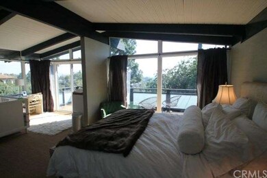 master bedroom with balcony and views