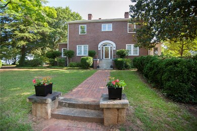 Historic Boxwood Garden on the right with Magnolia