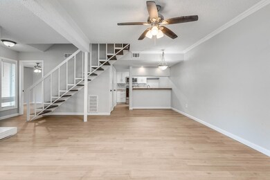 Unfurnished living room featuring a textured ceili