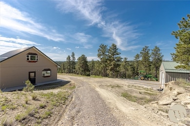 House & additional unit on left, oversized garage/