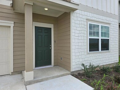View of exterior entry featuring board and batten