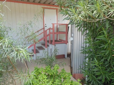 BACK PORCH AND VIEW OF WORKSHOP