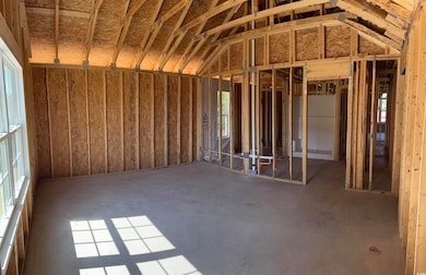Miscellaneous room featuring vaulted ceiling