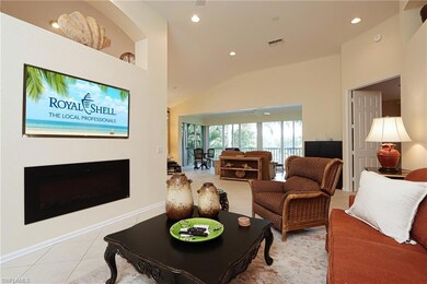 Living room with ceiling fan, light tile patterned