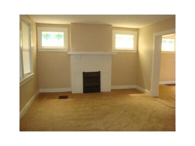 Living Room. A decorative fire place sets the mood