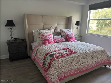 Bedroom featuring wood finished floors and baseboards