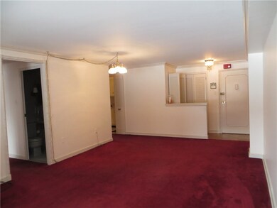 Living room facing entry door.
