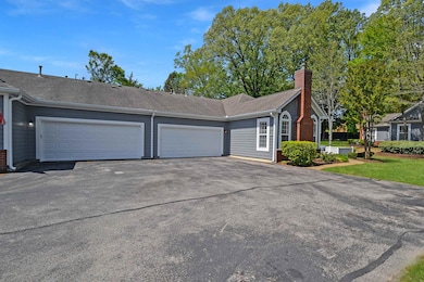 Attached parking with garage door opener and keypad.