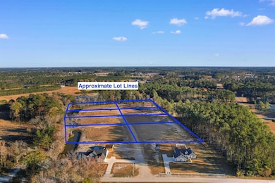 Aerial view of property's location featuring property parcel outlined