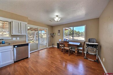 With Sliding Glass doors to covered patio