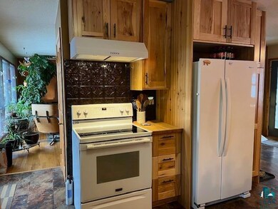 Kitchen featuring white appliances