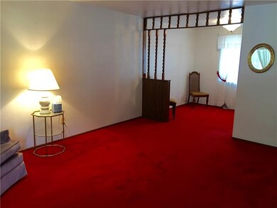 Living room and dining room.  Hardwood under carpe