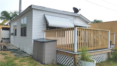 Side view of home, porch and storage