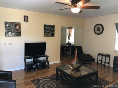 Living Room with Dining Room in Background.